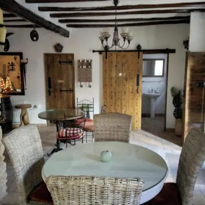 The dining room under the beams, tables laid