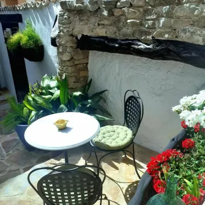 A quiet corner of the courtyard, flowers and old stone