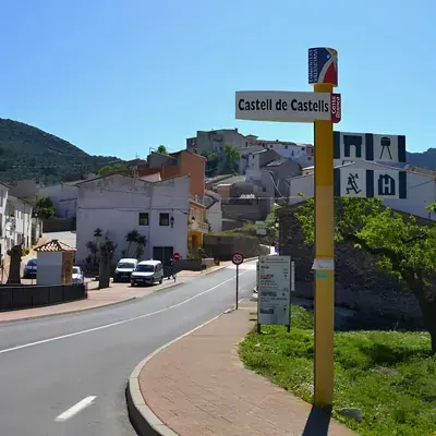 The Castell de Castells sign at the entrance to the village