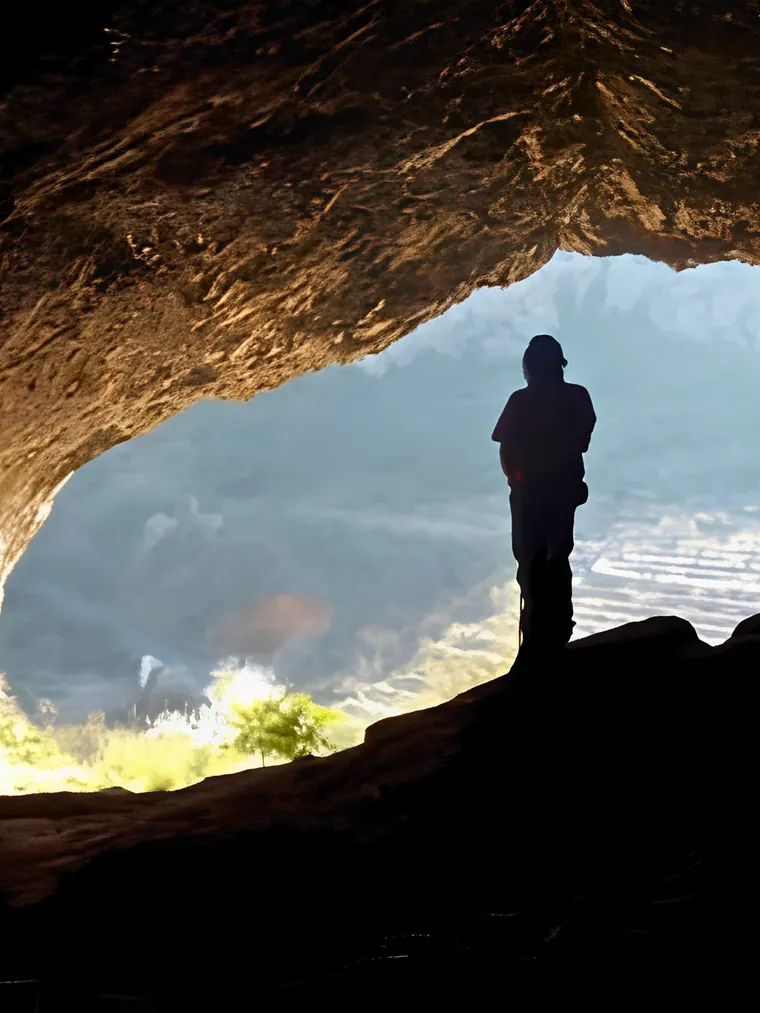 Standing inside one of the Pla de Petracos rock shelters, looking out over the valley